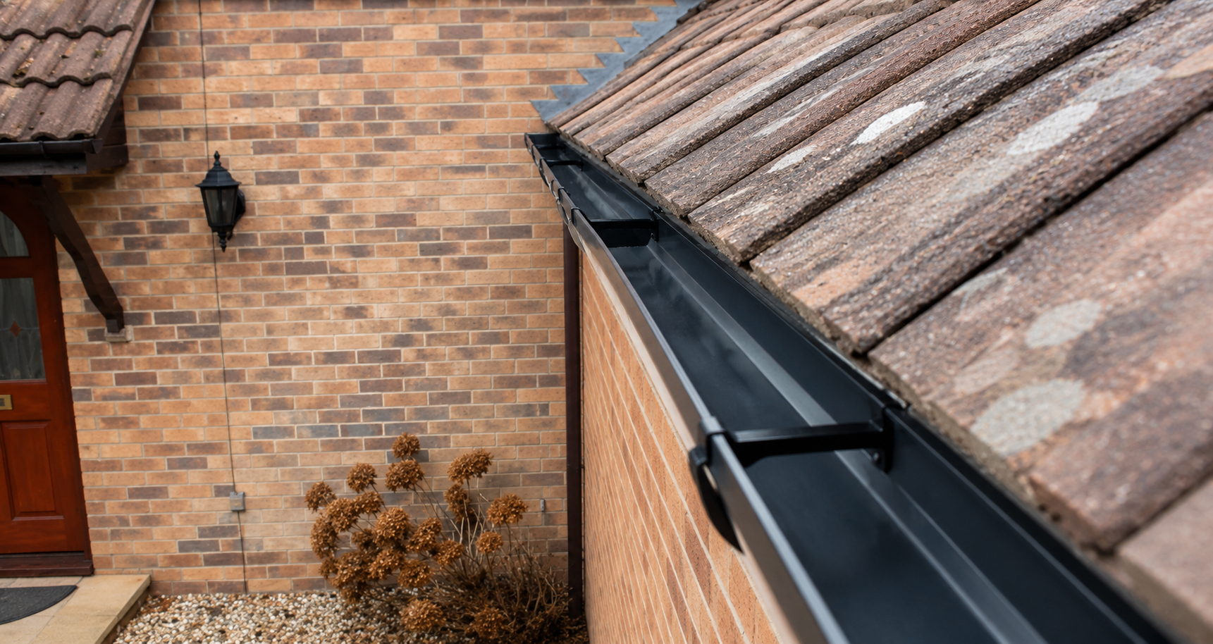 After professional gutter cleaning — channel fully cleared and flowing freely